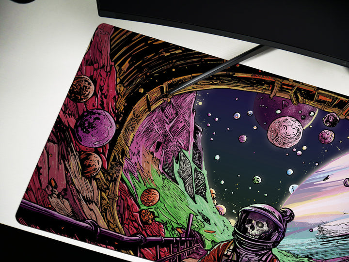 a computer mouse pad with a space scene on it